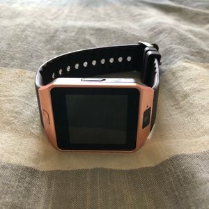 Rose gold and black smart watch with camera.